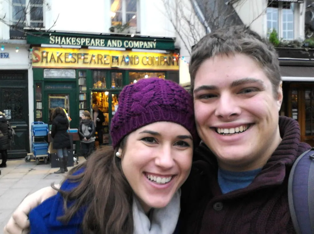 kate storm and jeremy storm in front of shakespeare and company on their first trip to paris france