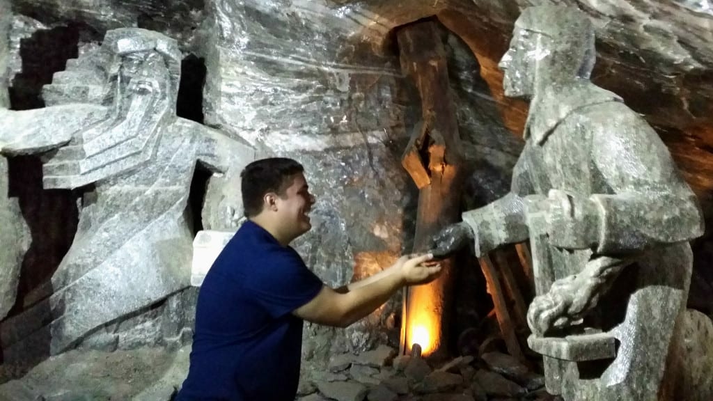 Jeremy Storm posing with statues in the Wieliczka Salt Mine during a couple days in Krakow Poland