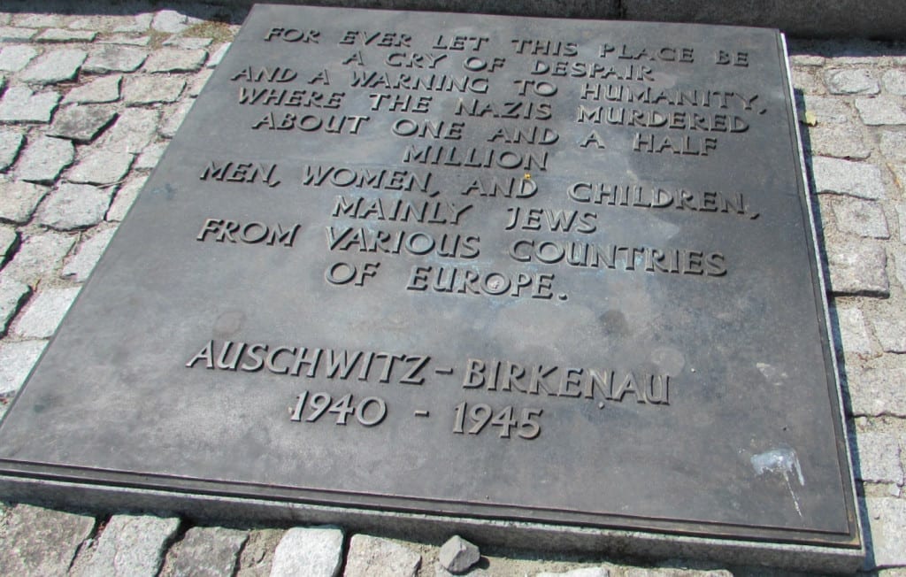 memorial plaque at auschwitz birkenau in english