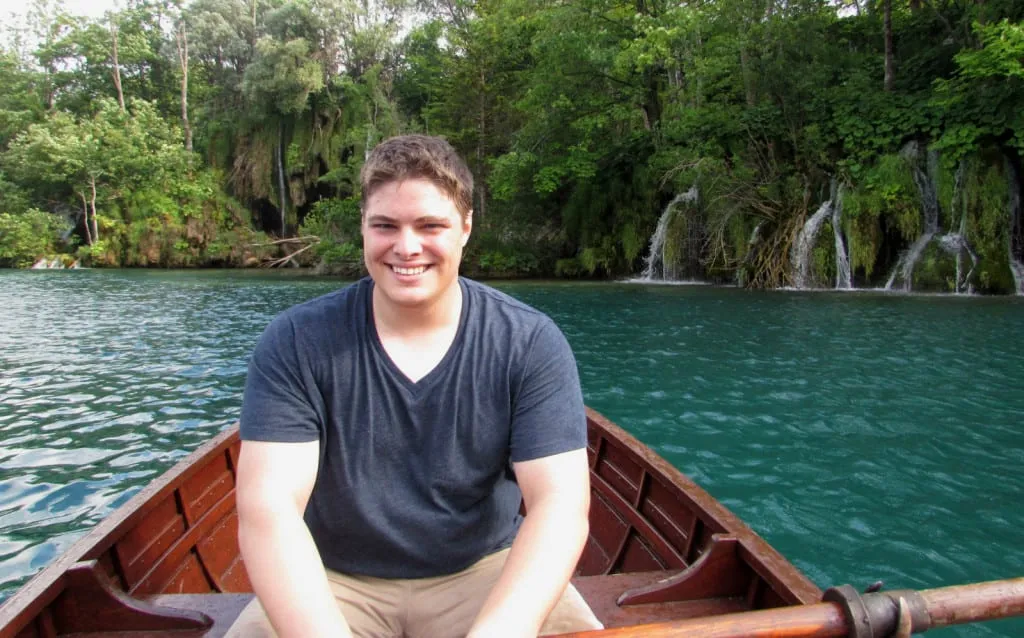 Jeremy Storm rowing across a lake in Plitvice Lakes Croatia