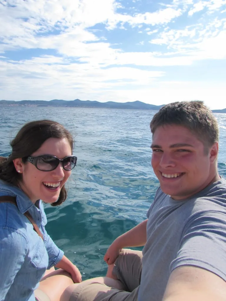 kate storm and jeremy storm at the sea organ in zadar croatia with water in the background