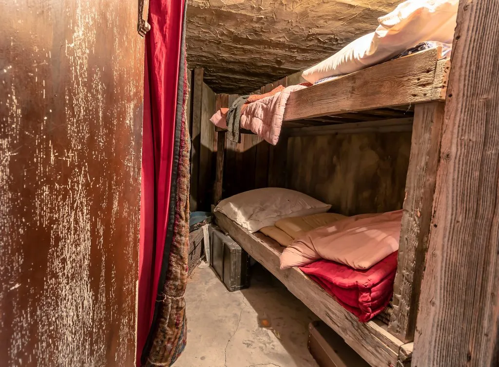 historic bedroom of jewish workers in oskar schindlers factory in krakow poland, showing bunk beds