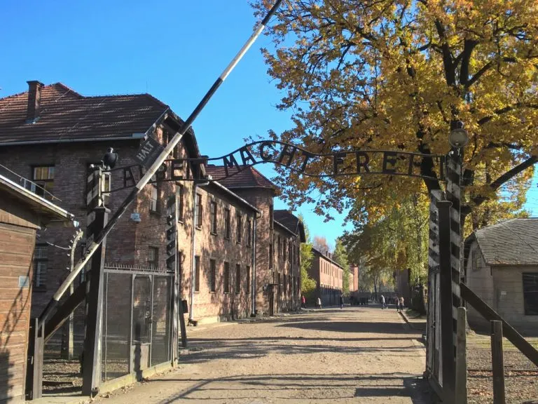 infamous gate that greets people who visit auschwitz from krakow, which reads "work will set you free"