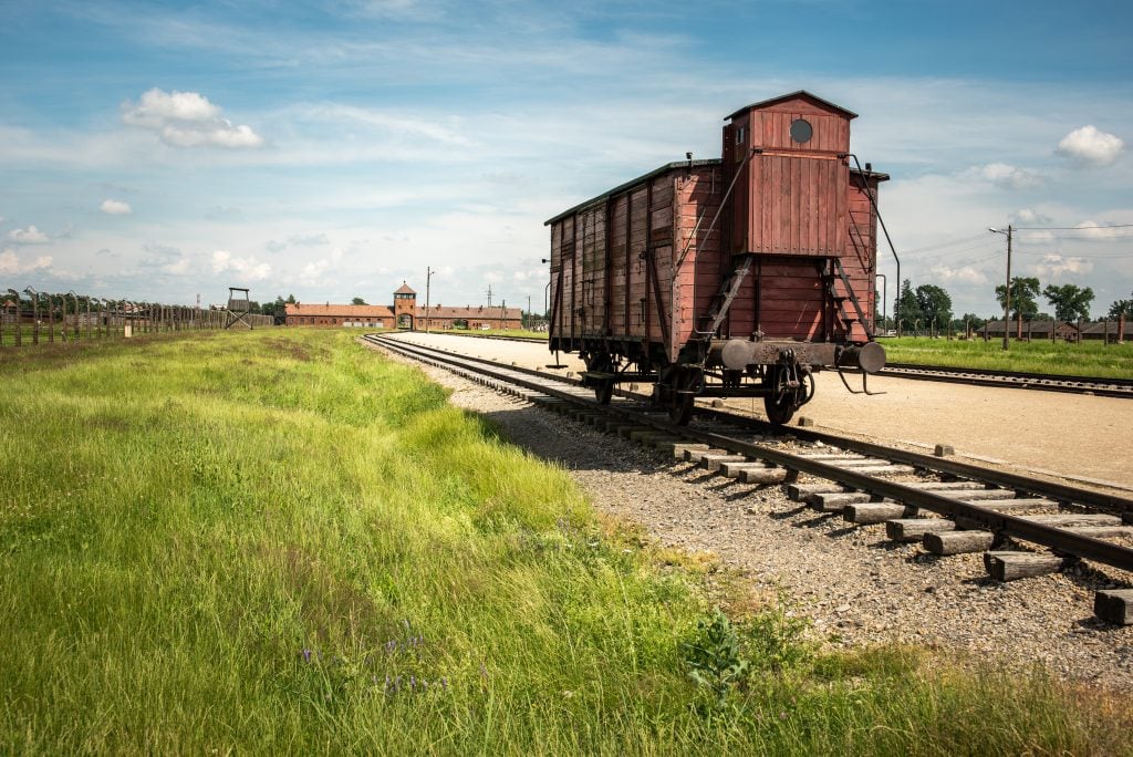 red train car parked at birkenau concentration camp