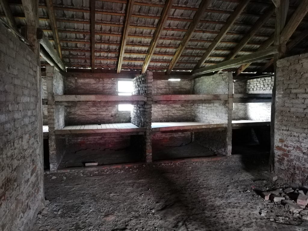 barracks in birkenau concentration camp showing prisoner sleeping pallets