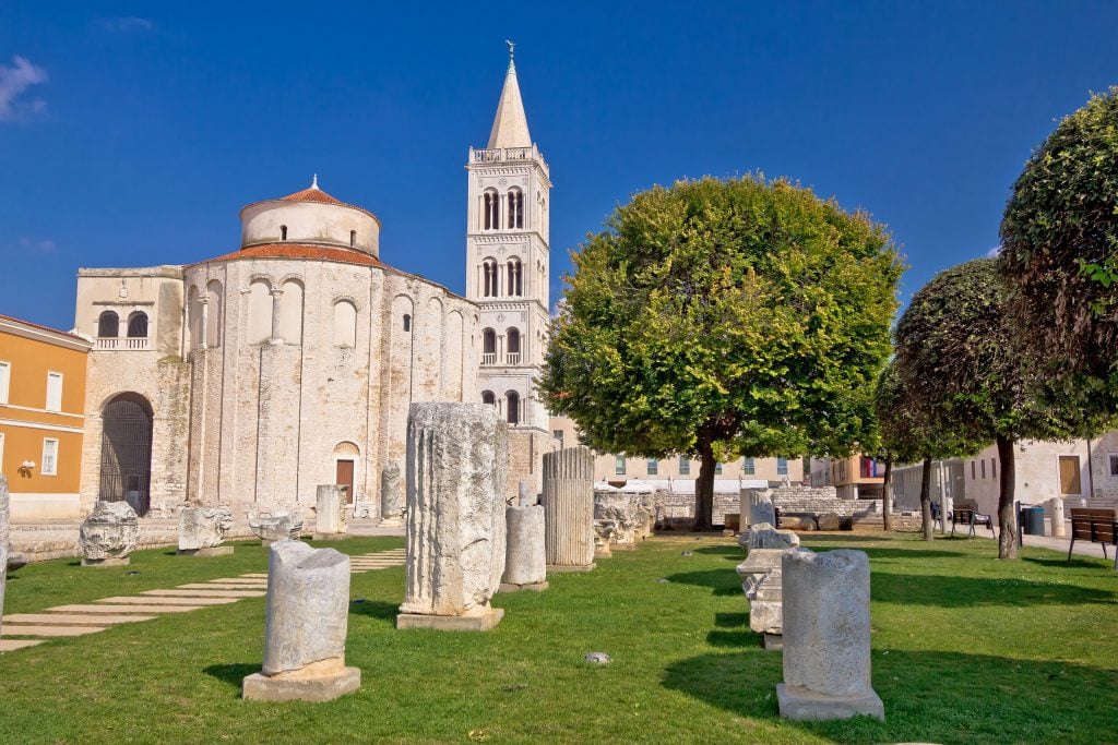 roman forum remains in zadar croatia with church of st donatus in the background