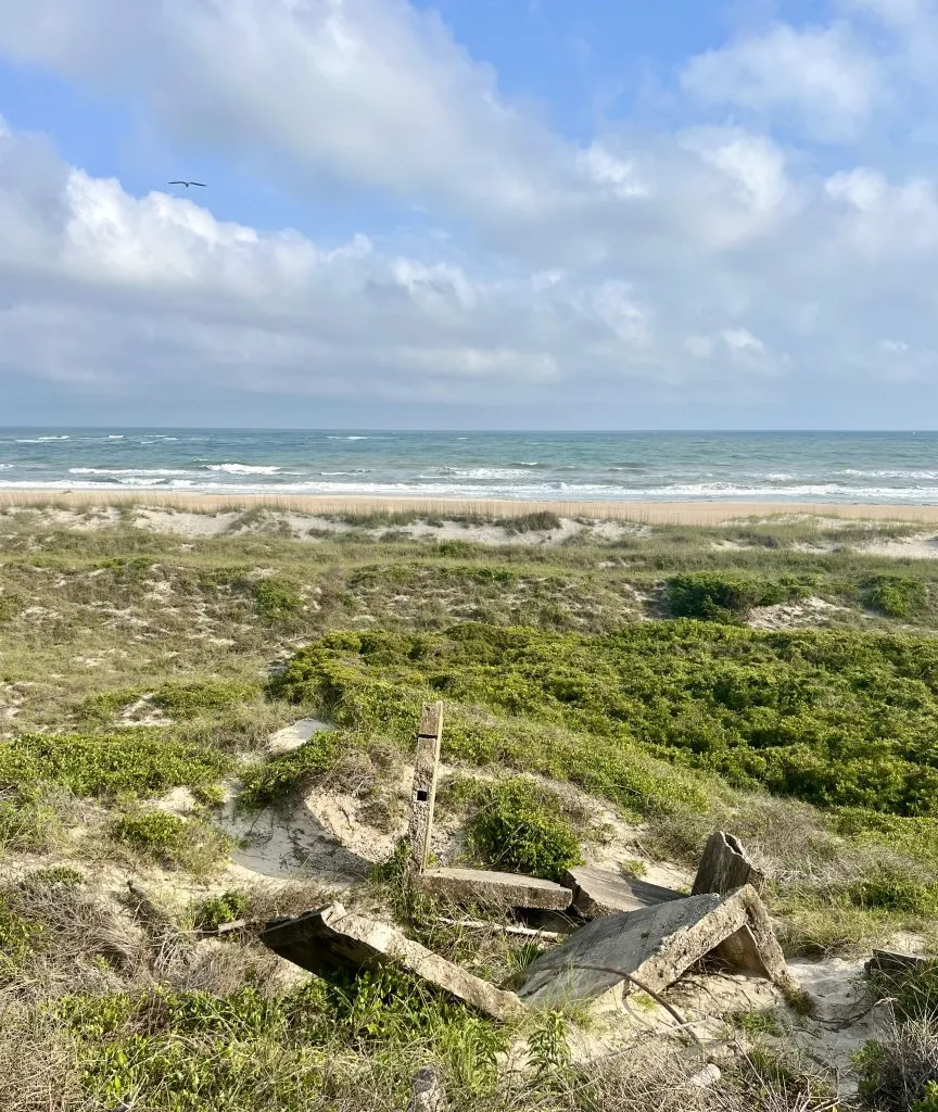 fort macon state park beach as seen from above in atlantic beach nc, with remains of a wwii bunker in the foreground