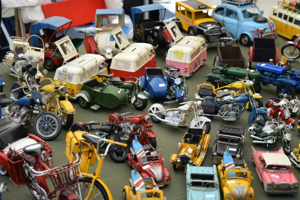 Table of small toys being sold at El Rastro Madrid Spain