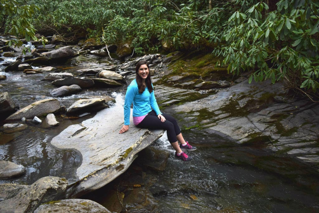 Kate Storm hiking in Great Smoky Mountains National Park, one of the best east coast USA road trip routes.