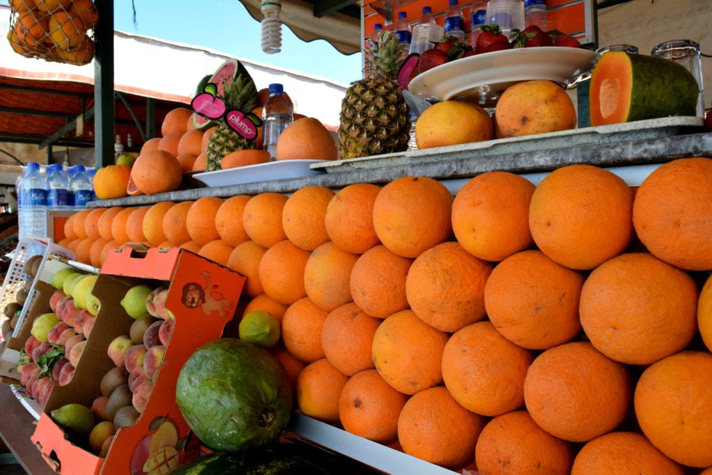 orange juice stand in marrakech. marrakech is an easy addition to a morocco travel budget