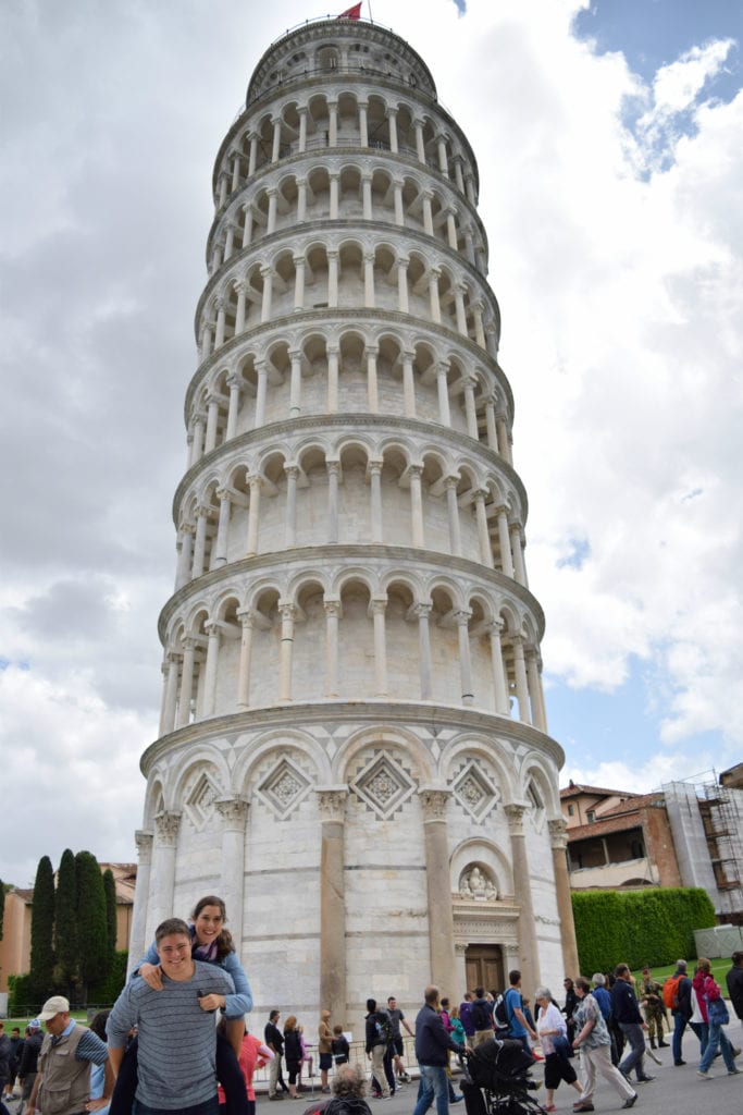 Kate Storm and Jeremy Storm at the Leaning Tower of Pisa-this bucket list spot is part of just about any Tuscany road trip itinerary!