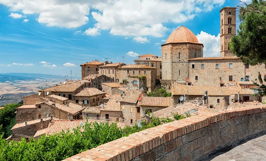 view of volterra italy from balcony overlooking town, one of the best things to do in volterra