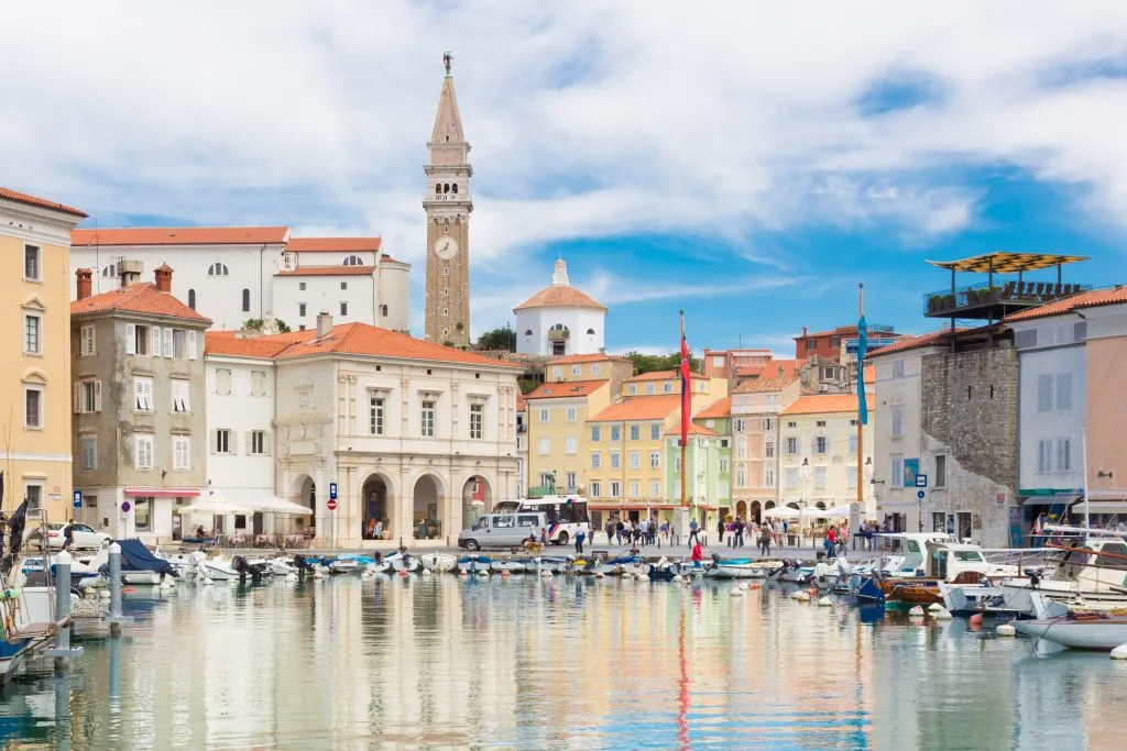 harbor of piran slovenia as seen from across the water, one of the best places to visit in piran