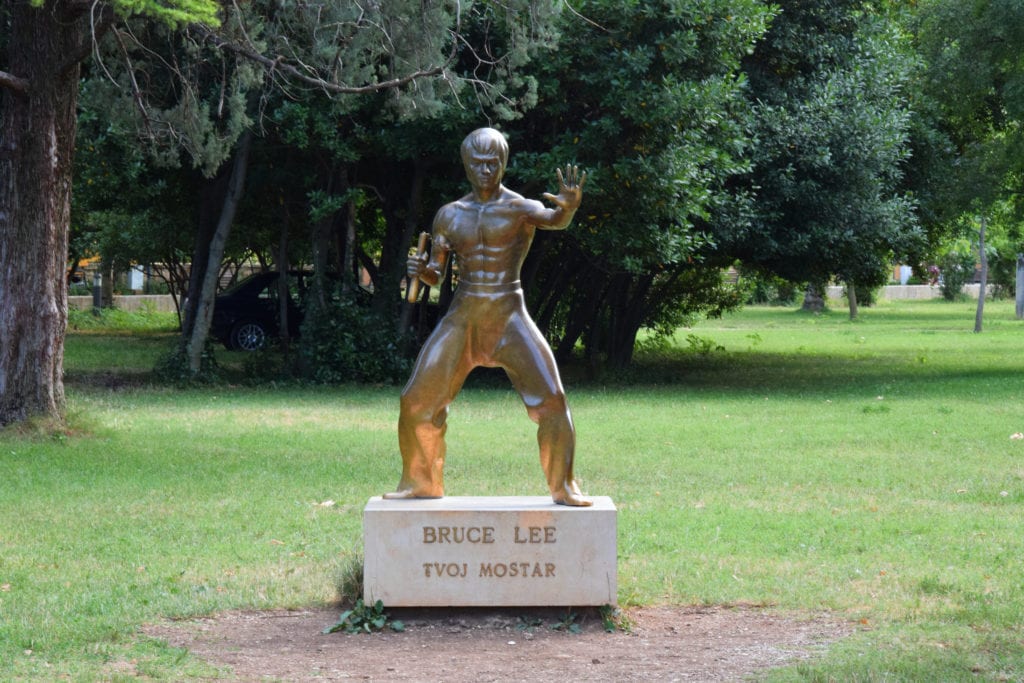 statue of bruce lee holding nunchucks in mostar bosnia and herzegovina