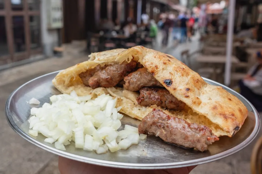 plate of traditional bosnia cevapi on a silver plate