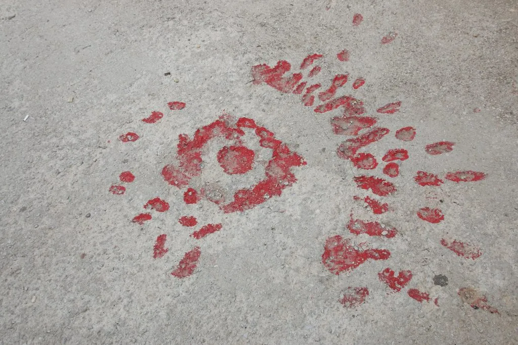 one of the sarajevo roses filled with red mortar as seen from above