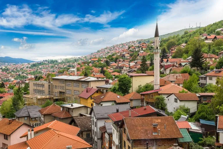 view of sarajevo bosnia and herzegovina skyline on a sunny day with a minaret prominent. old town is packed with some of the best things to do in sarajevo