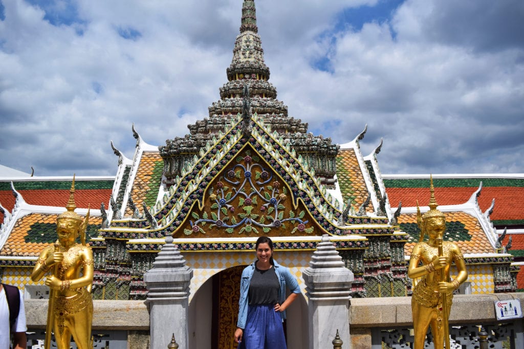 kate storm standing in front of a wat in the grand palace bangkok thailand