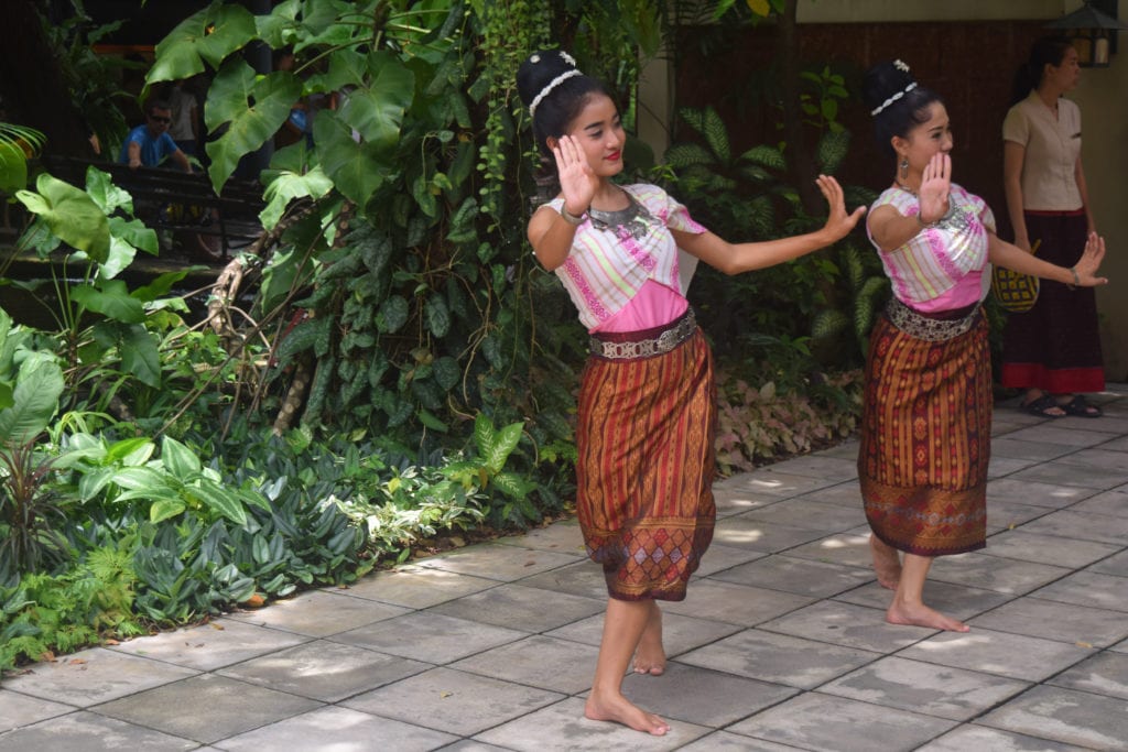 two thai women dancing at jim thompson house in bangkok thailand