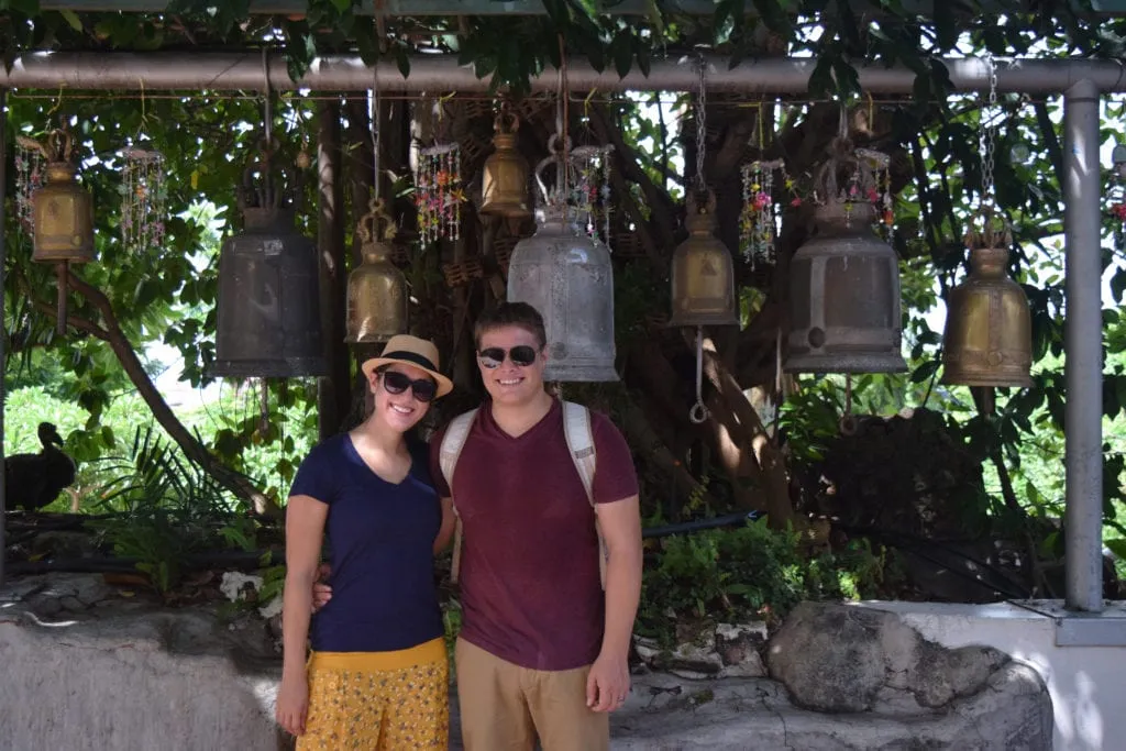 kate storm and jeremy storm in front of a collection of jars, wearing comfortable clothing--an essential bangkok travel tips