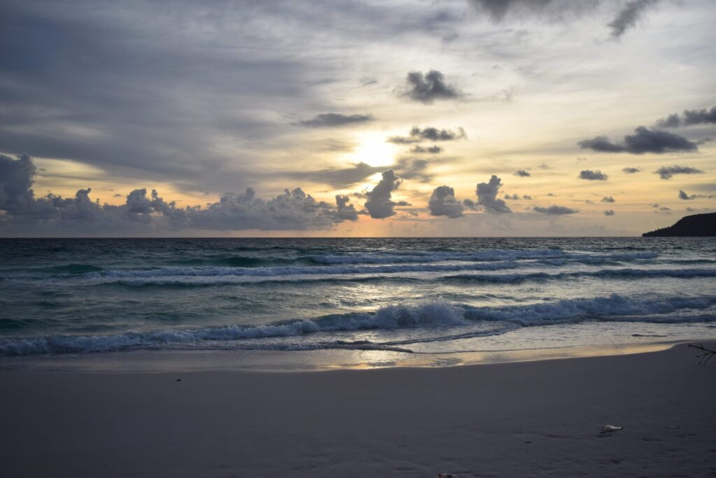 sunset over a sandy beach in koh rong cambodia