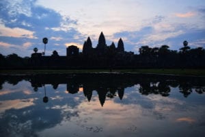 angkor wat sunrise over the main temple, one of the best things to do when touring angkor wat cambodia