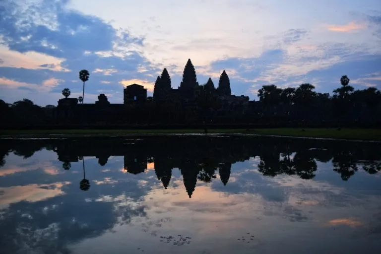 angkor wat sunrise over the main temple, one of the best things to do when touring angkor wat cambodia