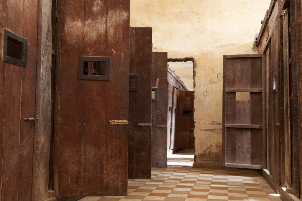 wooden doors in tuol sleng prison in phnom penh cambodia