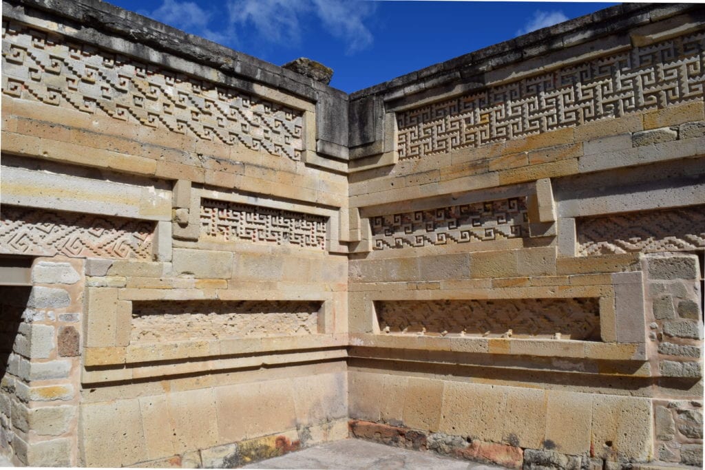 detailed shot of the carvings on the walls of mitla, one of the best things to do in oaxaca