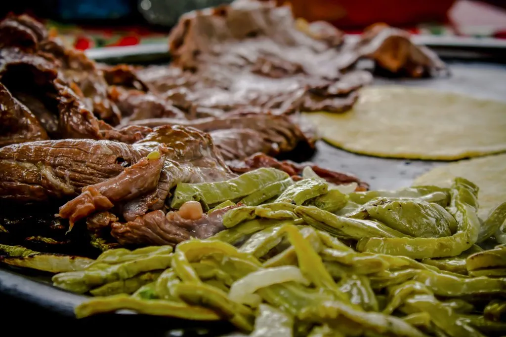 chiles meat and tortilla on a grill in mexico