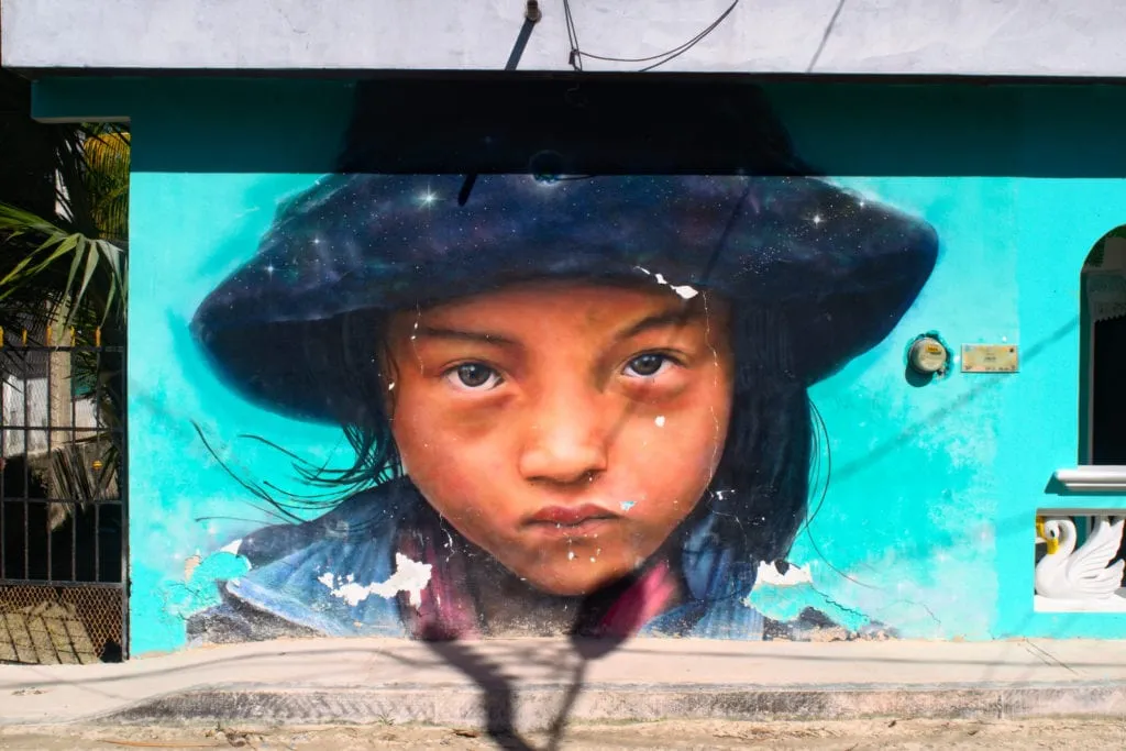 mural of a young girl on isla holbox, as seen while backpacking mexico americans