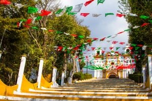 colorful flags leading to a church with viewpoint, one of the best things to do in chiapas mexico