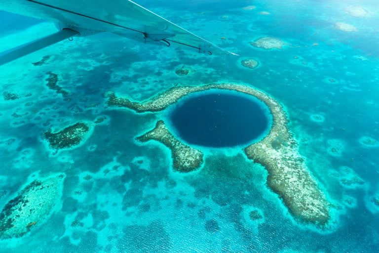 aerial view of the great blue hole, one of the best things to do in belize