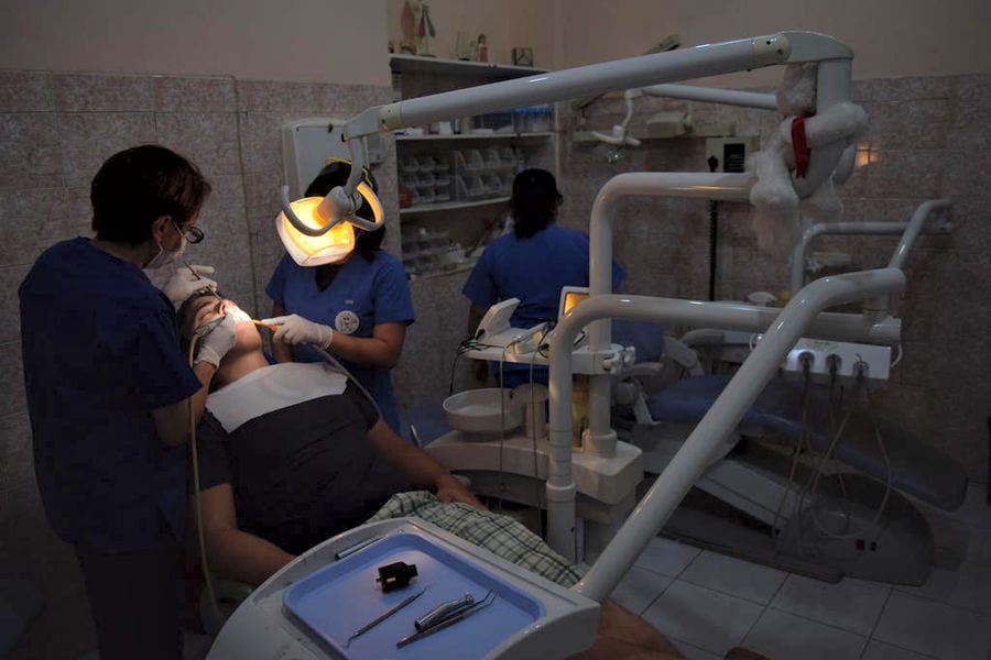jeremy storm having his teeth cleaned in a dentist in guatemala