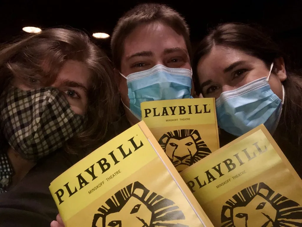 kate storm jeremy storm and michael bishop holding up lion king playbills in nyc