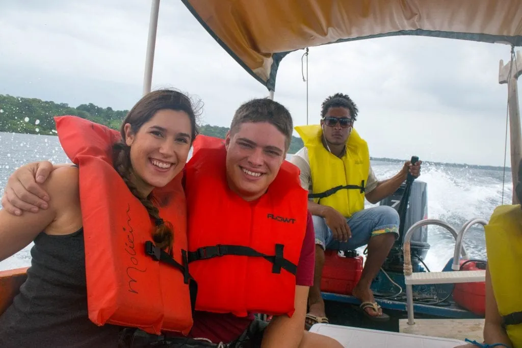 selfie of kate storm and jeremy storm on a boat wearing life jackets when visiting bocas del toro panama