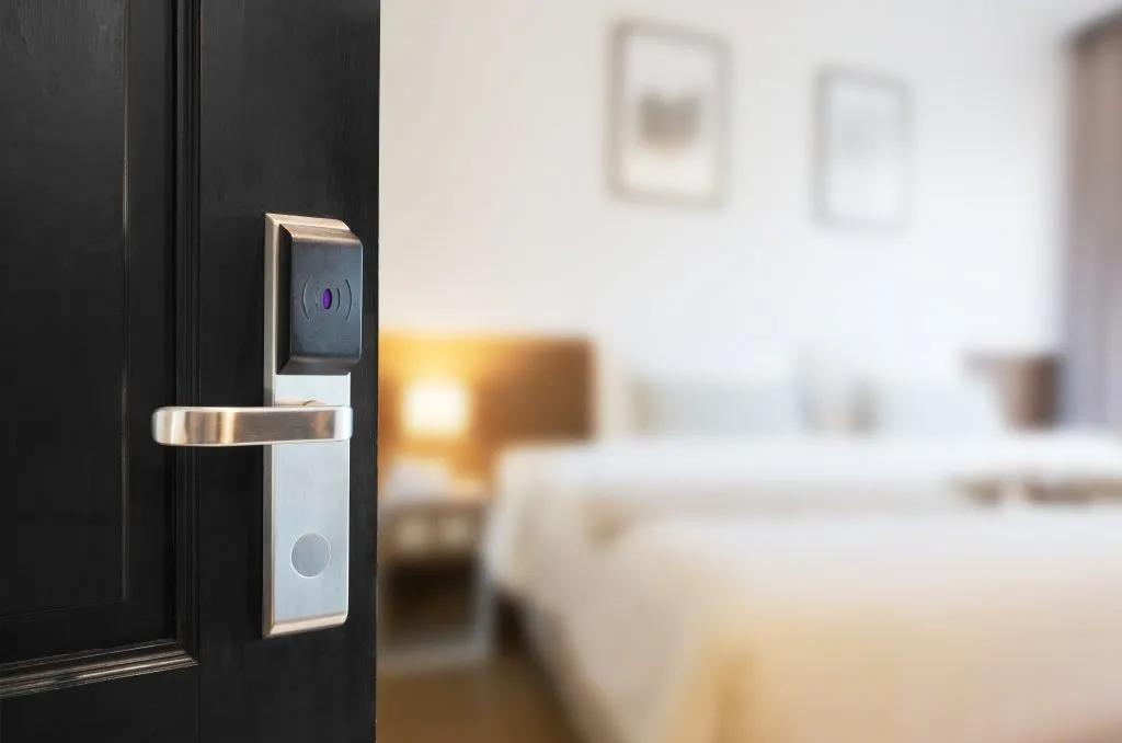 open door leading into bright and modern hotel room
