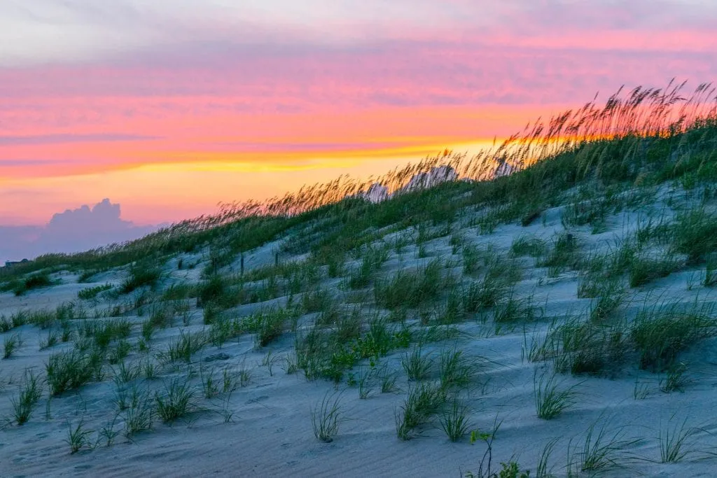 Sunset behind the sand dunes at Fort Macon State Park NC