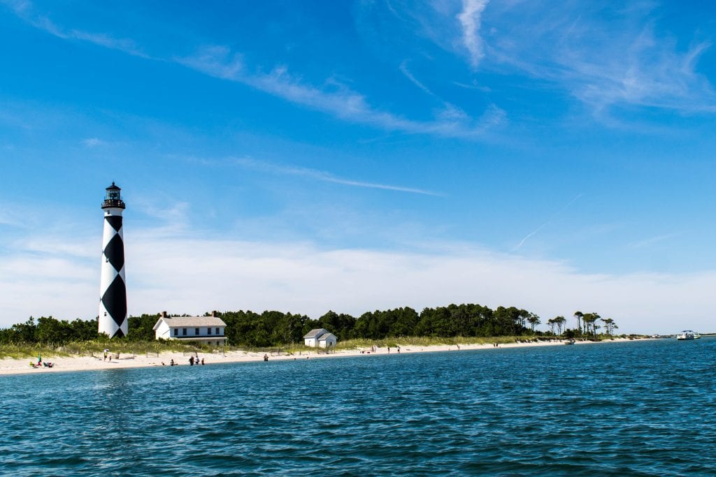 Cape Lookout NC as seen from the water with the keepers house next door