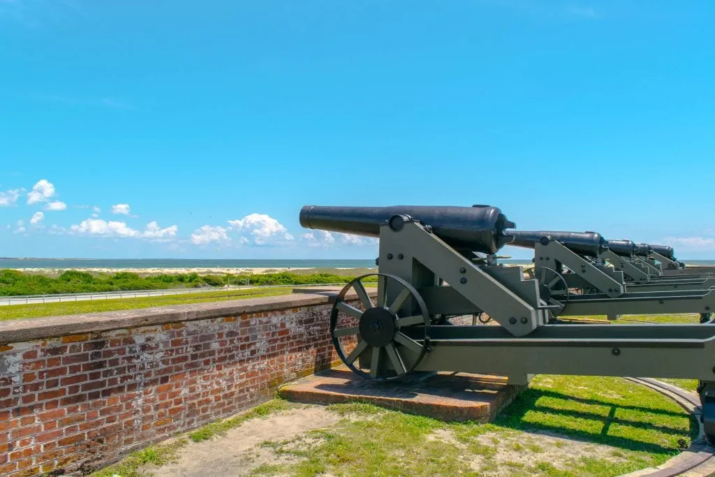 Cannons overlooking Fort Macon NC with the beach visible in the distance