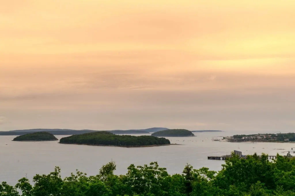 view of islands from cadillac mountain at sunset in maine