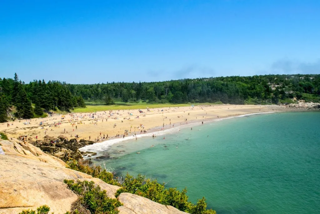 view of sand beach from above on a sunny summer day, belongs on any summer list of what to do in acadia np