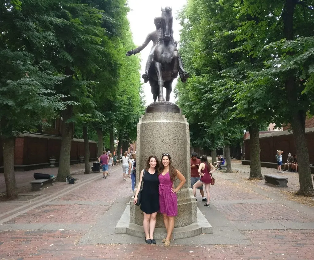 Kate Storm with a friend standing next to the Paul Revere statue in the North End in Boston MA