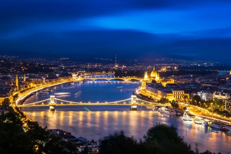 view of danube and budapest at night, a great view that may influence your decision to visit budapest or prague