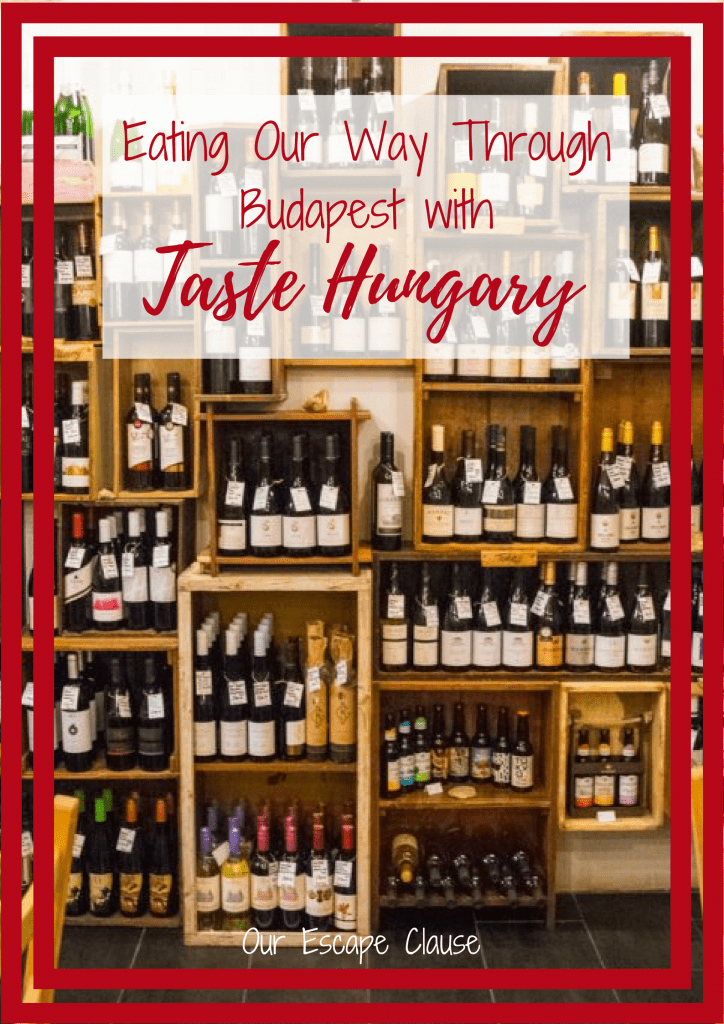 photo of wine for sale at the tasting table, red text on a white background reads "eating our way through budapest with taste hungary"