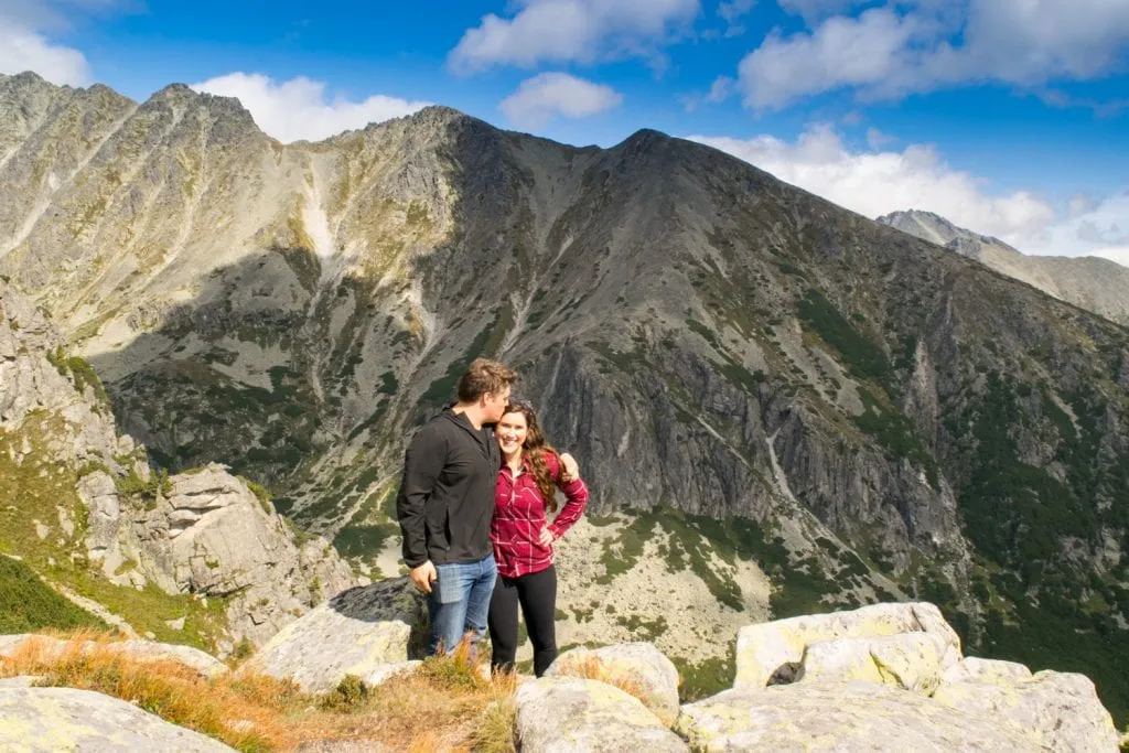 kate storm and jeremy storm standing at an overlooking slovakia hiking high tatras