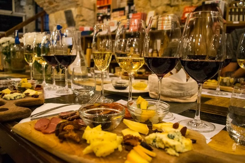 flight of wines set behind full charcuterie boards at a wine tasting in budapest hungary