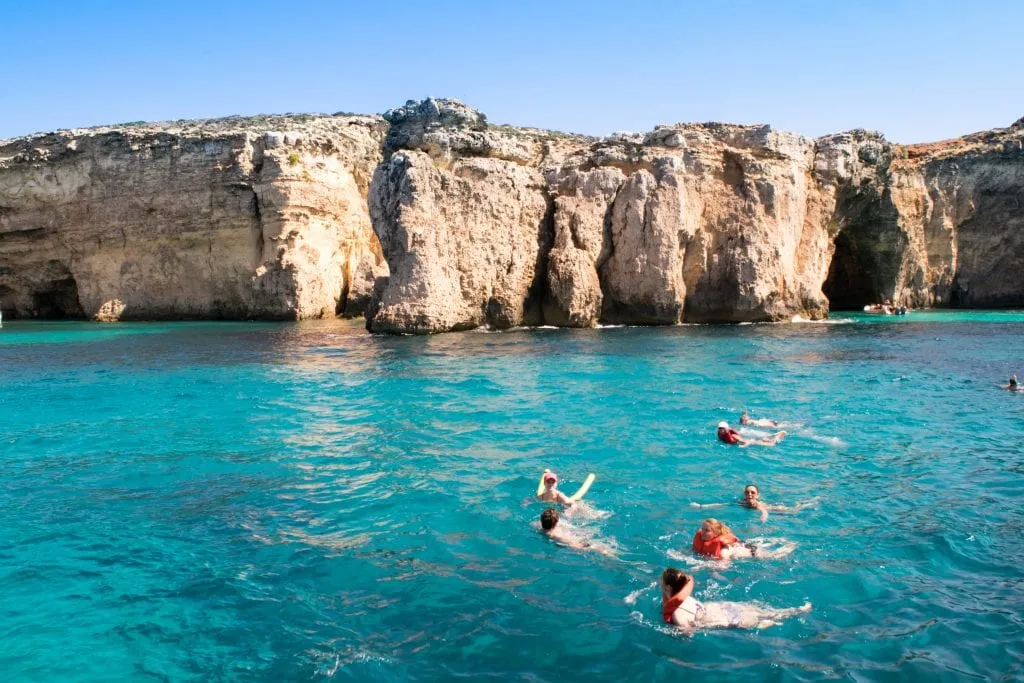travelers swimming in Crystal Lagoon, one of the best things to do malta