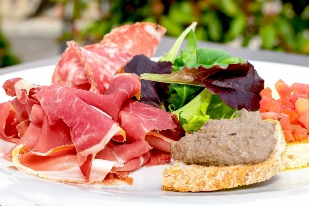 Plate of crostini and tagliere, one of the best Florence foods to eat as an antipasto