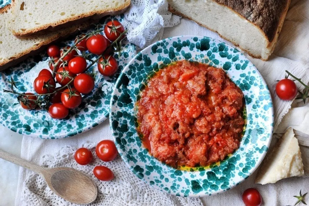 Pappa al pomodoro served in blue and white dishes shot from above, one of the best foods in Florence